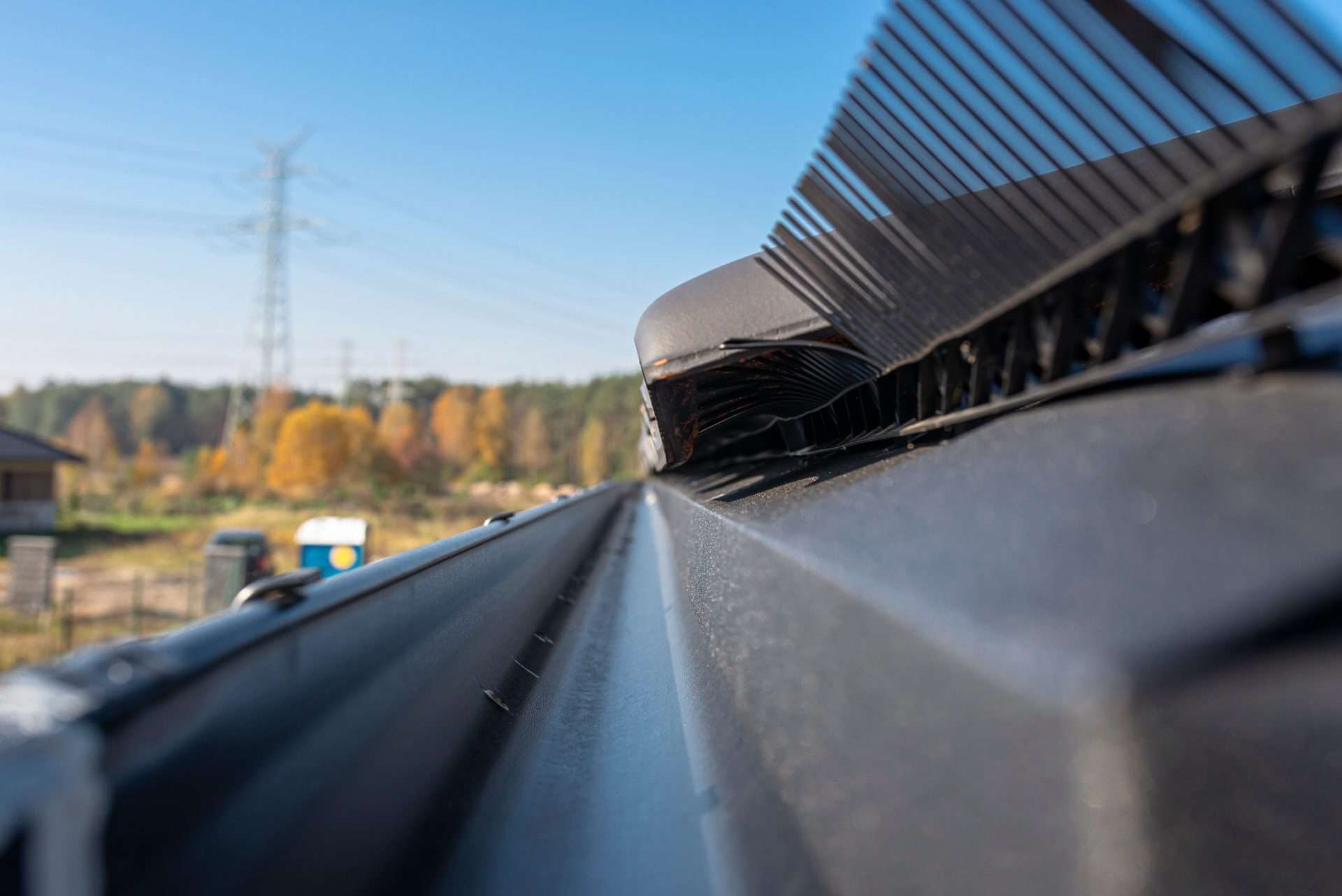 a close up of a clear guttering on a side of a property